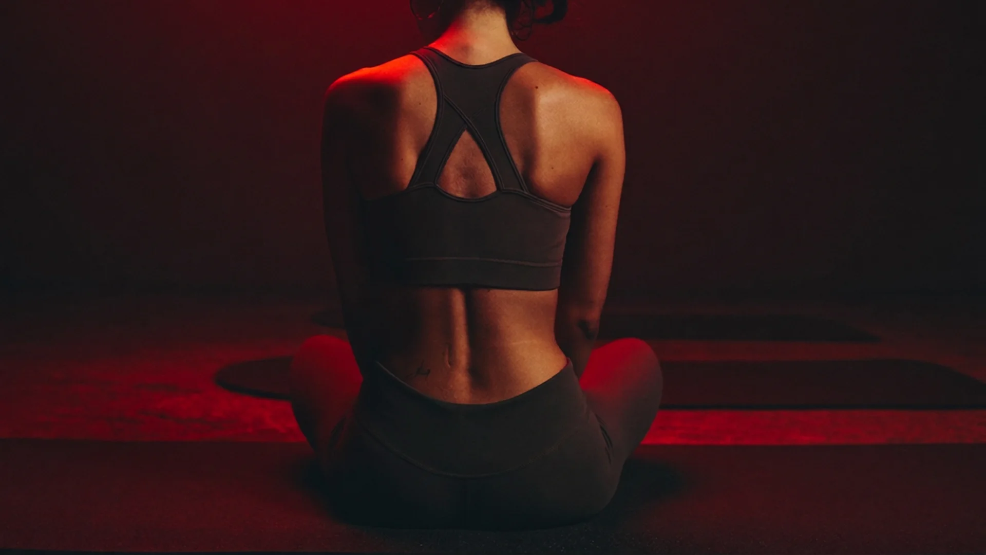 Shoulder bathed in soft red light